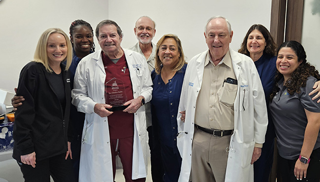 Dr Kahn with friends, celebrating 57 years